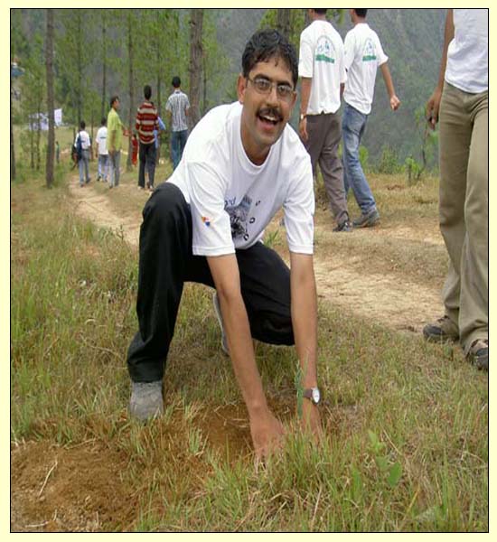 Rajan planting a tree